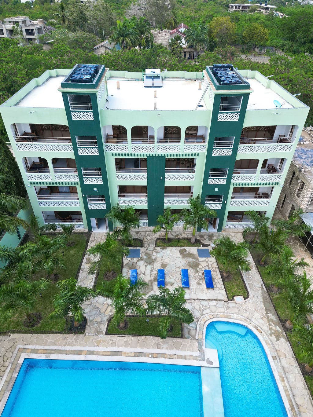 Aerial view of HappyLand Hotel Diani and its pool