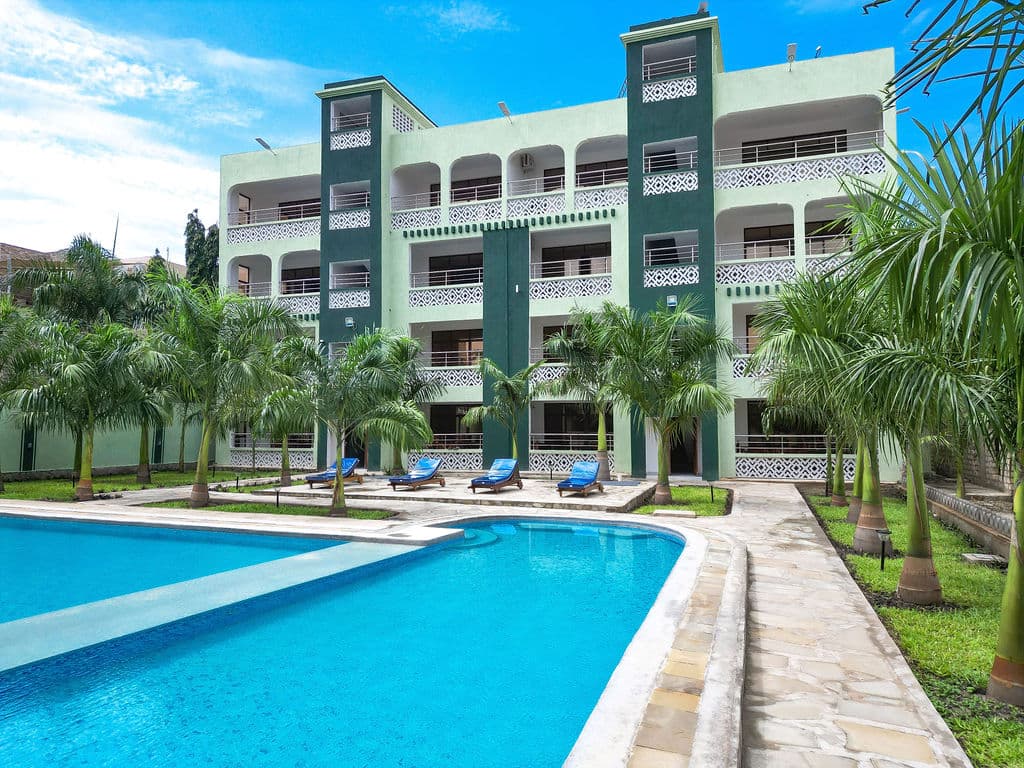 HappyLand Hotel Diani beside its swimming pool