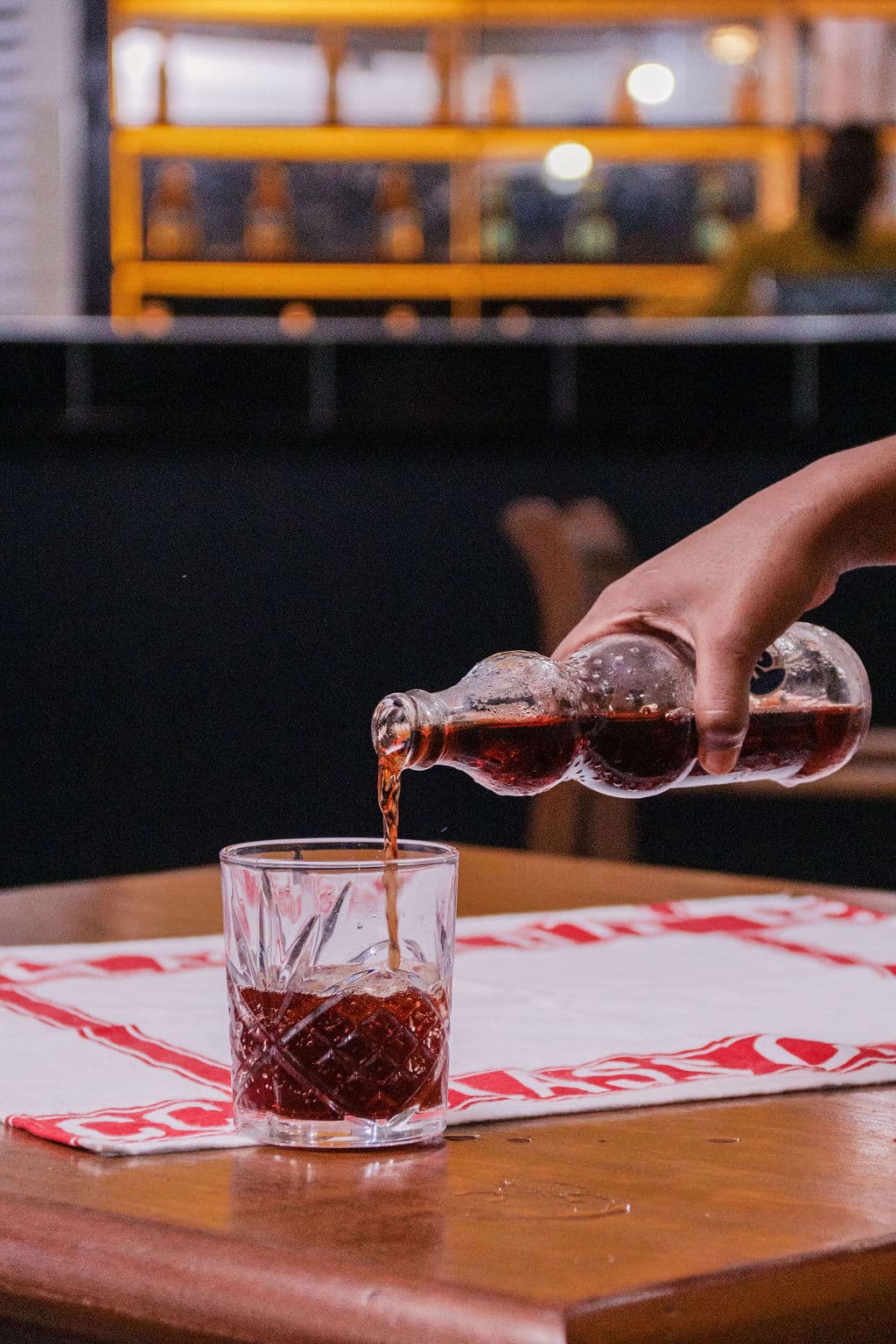 A drink being poured at a table