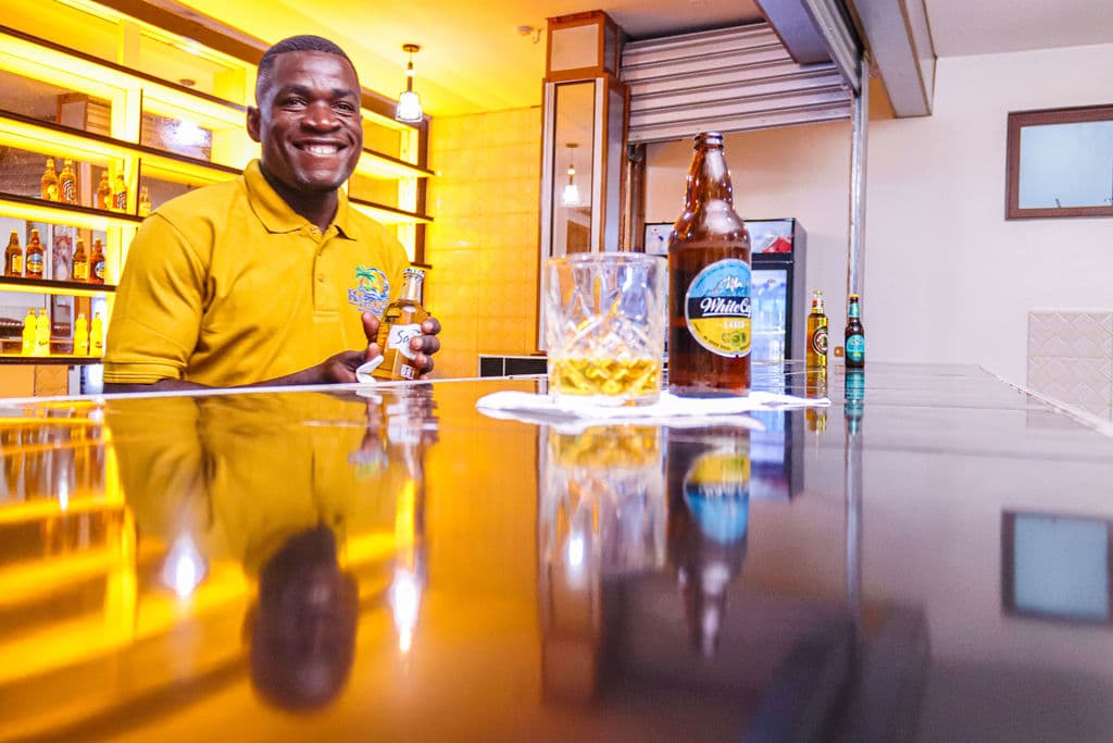 A member of the hotel team serving at the bar