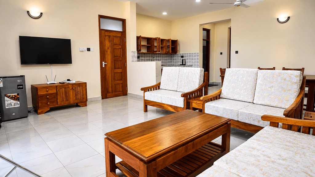 A furnished living area inside a HappyLand apartment